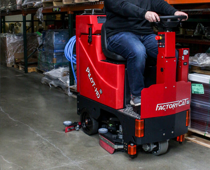 Factory Cat Pilot HD cleaning a warehouse floor